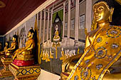 Chiang Mai - Wat Phra That Doi Suthep. The walls of the gallery are covered with Buddha statues and mural paintings of Jataka and tales of the previous lives of the Buddha.